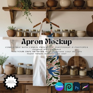 May include: A white apron with a blue and green floral pattern hanging on a wooden hanger. The apron is displayed in a kitchen setting with jars of food and wooden shelves. Text on the image reads "Apron Mockup".
