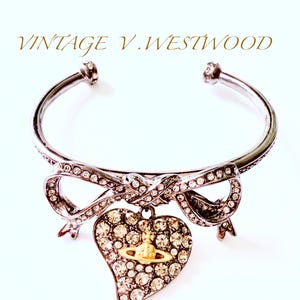 reduced by 50%VIVIENNE WESTWOOD rare vintage Saturn series titanium black bow love diamond peach heart bracelet