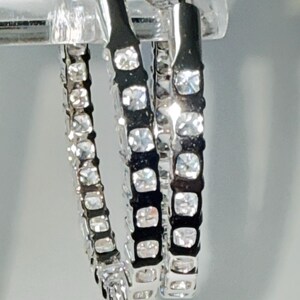 May include: A rustic wooden sign with the text "Welcome to our home" in white lettering. The sign features a distressed finish and a simple, inviting design, perfect for entryway decor.