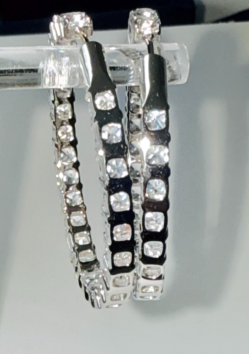 May include: A rustic wooden sign with the text "Welcome to our home" in white lettering. The sign features a distressed finish and a simple, inviting design, perfect for entryway decor.