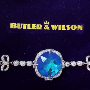 A lovely vintage adjustable Butler and Wilson silver crystal blue stone butterfly detail adjustable bracelet signed  new