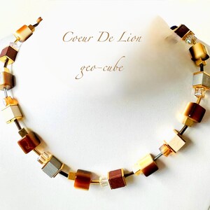 A beautiful signed Coeur De Lion single stranded geocube gold plated  necklace with crystals (boxed). new with tag