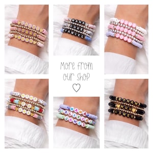May include: A collection of personalized beaded bracelets in various colors, including pink, blue, and black. Each bracelet features gold-colored beads and lettered beads spelling out names and words. The image also includes the text "More from our shop".