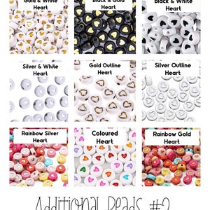 May include: A collection of heart-shaped beads in various colors and styles. The beads include gold and white, black and gold, black and white, silver and white, gold outline, silver outline, rainbow silver, colored, and rainbow gold. Text reads "Additional Beads #2."
