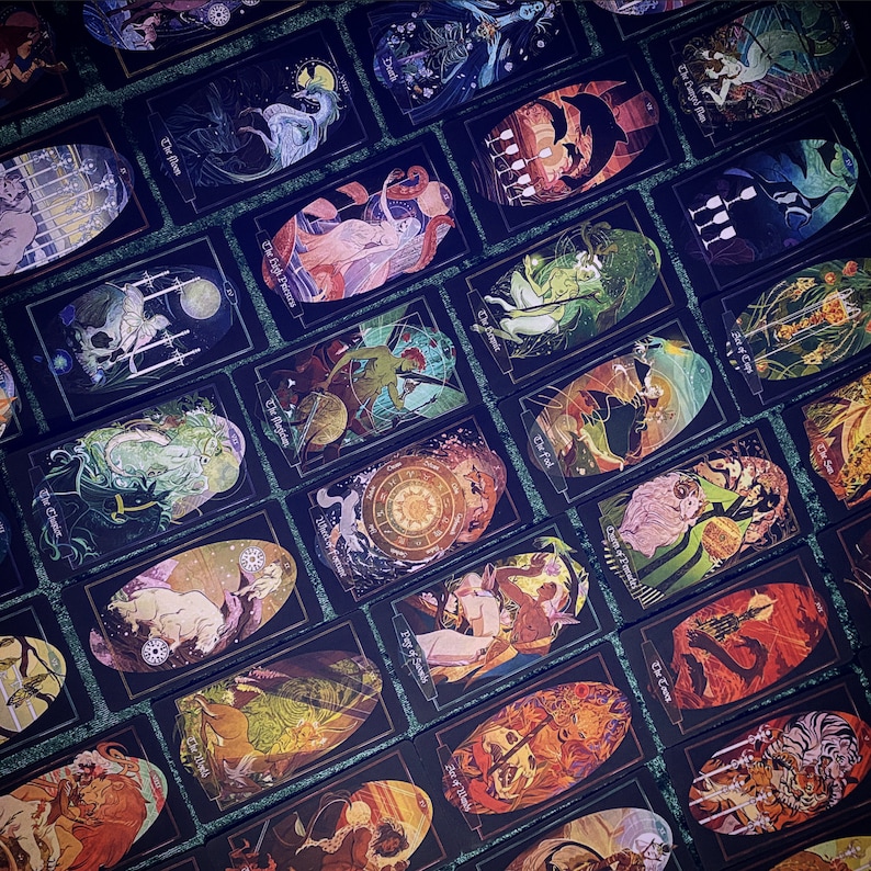 Giant spread of Litha cards with: Judgment, Nine of Wands, The Moon, Death, Four of Swords, The High Priestess, Six of Cups, The Hanged Man, The Chariot, The Magician, The Hermit, Four of Cups, Two of Pentacles, Wheel of Fortune and others shown.