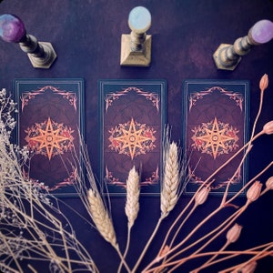 Three card spread, with only the backs facing towards the viewer.  Using the Children of Litha.