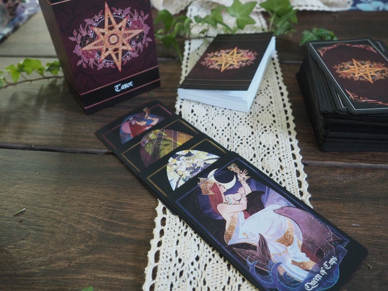 Closeup of Queen of Cups and other tarot cards from The Children of Litha, by Xia Hunt.