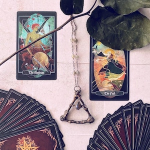 The Magician and The Fool cards.  Handmade electrofoamed necklace with Labordorite center stone, created by Xia Hunt.  More custom jewelry for sale at xiahunt.com while supplies last.