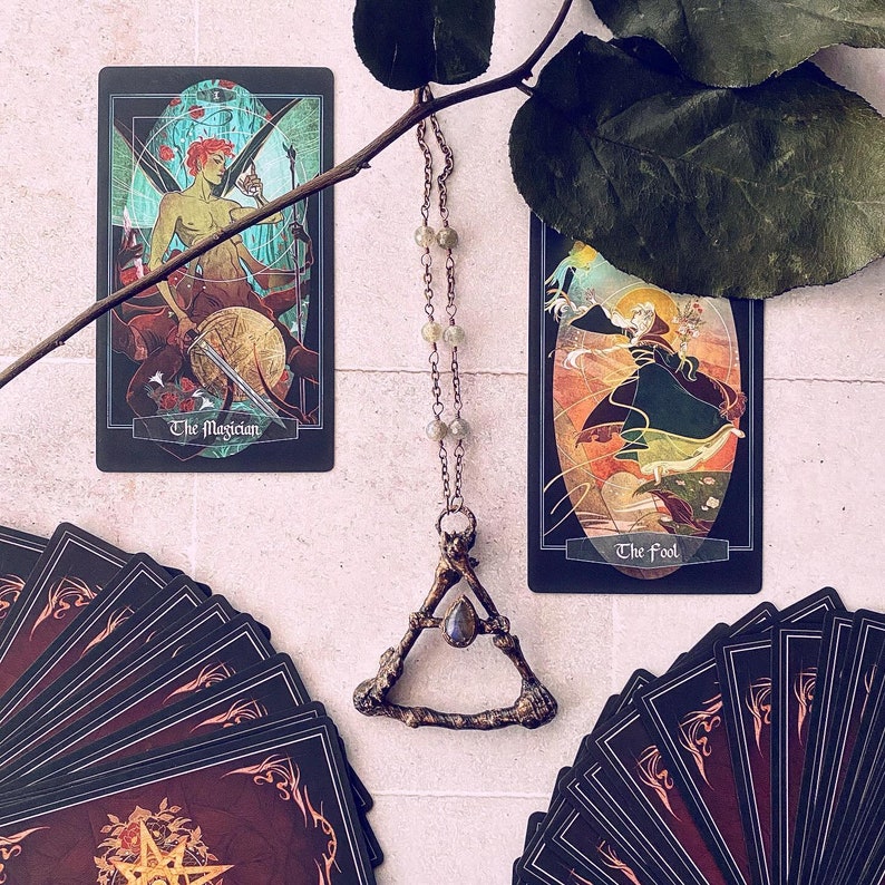The Magician and The Fool cards.  Handmade electrofoamed necklace with Labordorite center stone, created by Xia Hunt.  More custom jewelry for sale at xiahunt.com while supplies last.