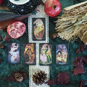 The Empress card is above a row of four other Litha cards.  With The Queen of cups being first, followed by Queen of Wands, Queen of Pentacles, and lastly Queen of Swords.