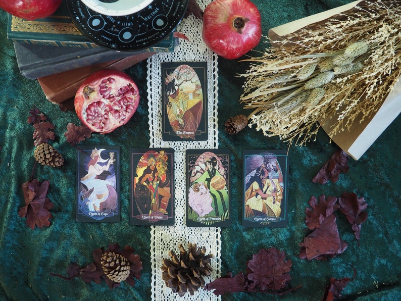 The Empress card is above a row of four other Litha cards.  With The Queen of cups being first, followed by Queen of Wands, Queen of Pentacles, and lastly Queen of Swords.