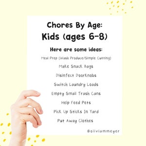 May include: A white paper with the text "Chores By Age: Kids (ages 6-8)" and chore ideas like "Meal Prep" and "Make Snack Bags". The paper is held by a hand against a yellow background with yellow dots.