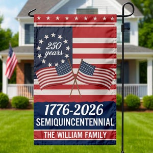 May include: A garden flag with an American flag design, including two crossed flags. The flag displays the text "250 years" and "1776-2026 SEMIQUINCENTENNIAL THE WILLIAM FAMILY". The flag is mounted on a black metal stand.