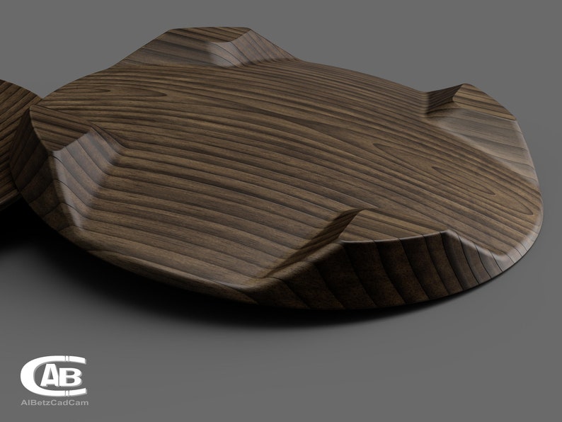 Puede incluir: Un posavasos de madera con un acabado de grano de madera marr&oacute;n oscuro y un dise&ntilde;o geom&eacute;trico &uacute;nico. El posavasos tiene cuatro bordes elevados que crean una forma distintiva.