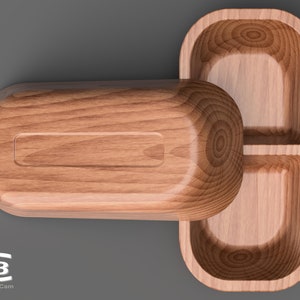 Könnte beinhalten: Ein Holztablett mit zwei Fächern. Das Tablett ist aus hellbraunem Holz gefertigt und hat eine glatte, polierte Oberfläche.