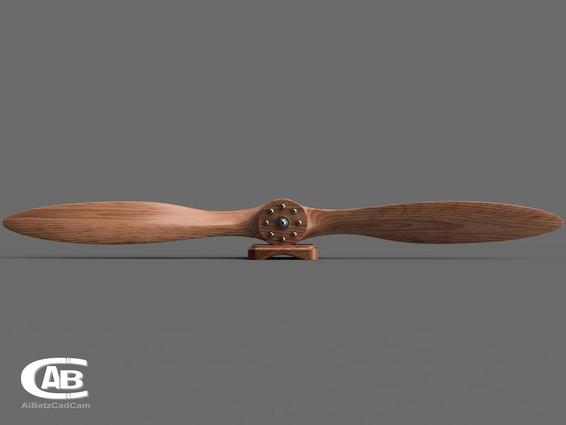 May include: A wooden airplane propeller with a brown finish and a metal hub with silver accents. The propeller is mounted on a small wooden stand.