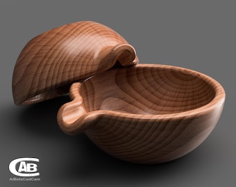 May include: A wooden bowl with a lid, both made of light brown wood with a grain pattern. The bowl has a rounded shape and a small spout on one side. The lid is slightly domed and fits snugly over the bowl.