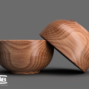May include: Two wooden bowls, one stacked on top of the other. The bowls are made of light brown wood with a natural grain pattern.