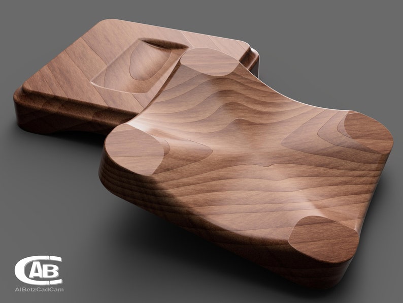 May include: Two wooden trays, one with a curved, indented surface and the other with a flat surface. The trays are made of light brown wood with a natural grain pattern.