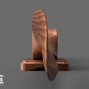 May include: A wooden propeller mounted on a wooden base. The propeller is brown and has a natural wood grain. The base is also brown and has a natural wood grain.