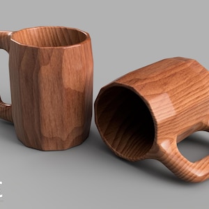 May include: Two wooden mugs with a faceted design. One mug is upright, and the other is lying on its side. The mugs are made of a light brown wood with visible grain. The mugs have a large handle.