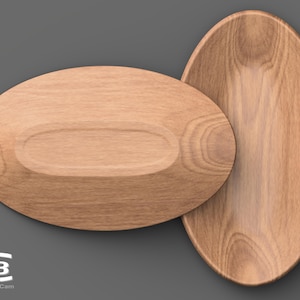 Può includere: Due ciotole ovali in legno per servire, una leggermente più piccola dell'altra, con una finitura a venature di legno naturale. Le ciotole sono impilate l'una sull'altra.
