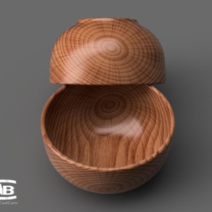 May include: Two wooden bowls stacked on top of each other. The bowls are made of light brown wood with a natural grain pattern.