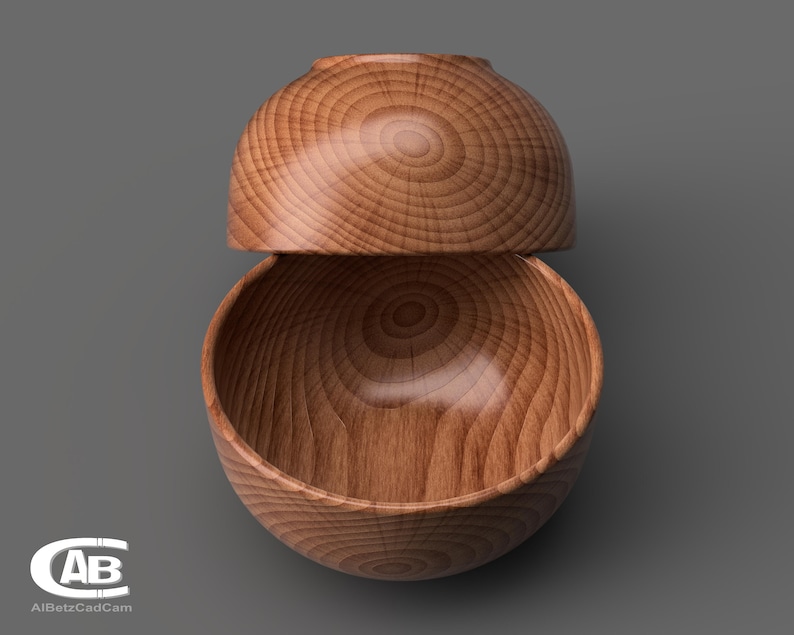 May include: Two wooden bowls stacked on top of each other. The bowls are made of light brown wood with a natural grain pattern.