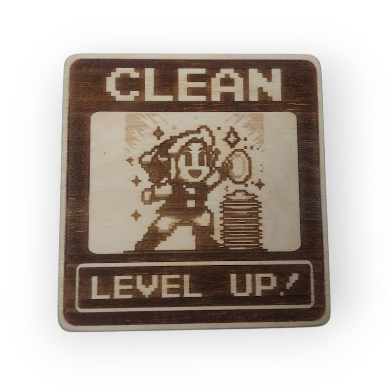 May include: A wooden sign with a pixelated image of a person holding a cleaning tool and stars. The sign says "CLEAN LEVEL UP!" in a pixelated font.