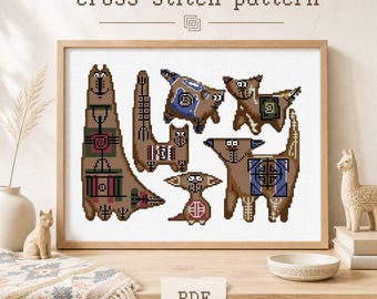 May include: A cross stitch pattern featuring six stylized brown cats with geometric patterns in blue, red, and green. The cats are depicted in various poses and shapes. The text cross stitch pattern and PDF are clearly visible on the image.