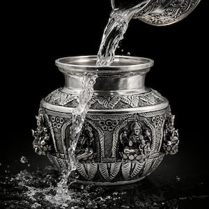 May include: A set of three ceramic canisters with lids. The canisters are white with a textured surface and feature a geometric pattern in shades of blue and gray. The lids are a matching blue-gray color.