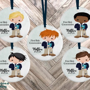 May include: Five round ceramic ornaments with images of boys in first communion attire. Each ornament features a different boy with a different hair color and skin tone. The text on each ornament reads "First Holy Communion" and "Matthew 04.25.24".
