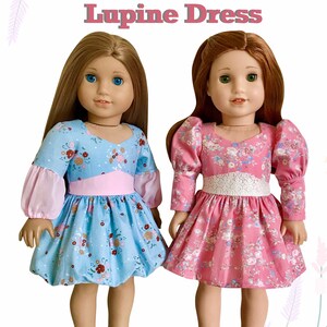 May include: A PDF sewing pattern for a "Lupine Dress" for 18 inch dolls, such as American Girl dolls. The pattern is for a confident beginner. The image shows two dolls wearing the dress in blue and pink floral prints.
