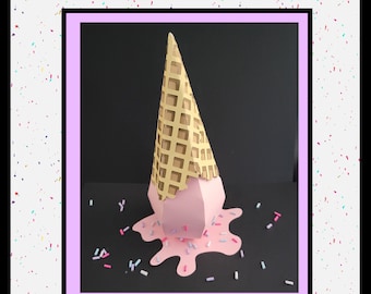 May include: A pink and gold ice cream cone box with a waffle cone design. The ice cream is melting and dripping down the sides of the cone. The box is decorated with colorful sprinkles.