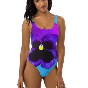 Designer Floral Pansy Women’s One Piece Swimsuit | High Cut Leg, Scoop Back | Resort, Spa, Cruise Wear | With Blue Background