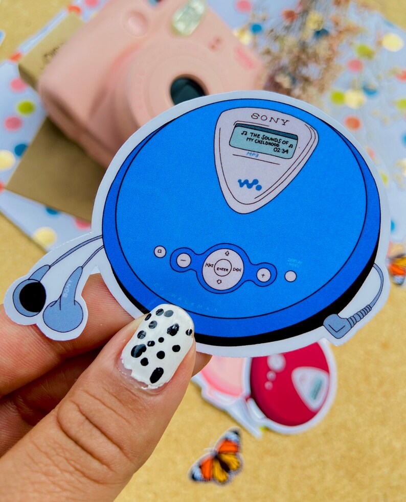 May include: A blue and white sticker of a Sony MP3 player with headphones. The screen displays "THE SOUNDS OF A MY CHILDHOOD 02:34 MP3".
