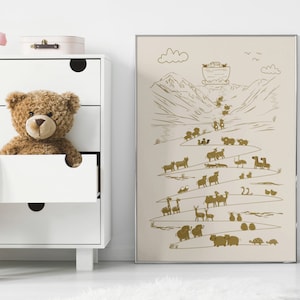 May include: A beige framed print with a gold illustration of Noah's Ark and animals on a winding path. The text "22." is visible on the print.