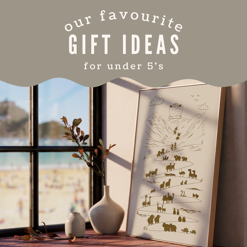 May include: A beige framed print with a gold illustration of a boat with animals on a mountain path. The text "our favourite GIFT IDEAS for under 5's" is at the top of the image.