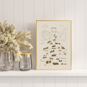 May include: A gold framed print with a white background and a brown illustration of a boat with animals on a mountain path. The text "22" is visible in the illustration.