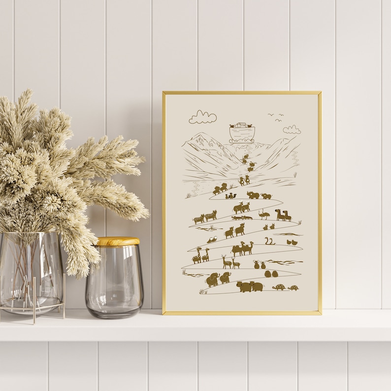 May include: A gold framed print with a white background and a brown illustration of a boat with animals on a mountain path. The text "22" is visible in the illustration.