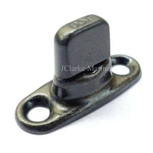 May include: Black metal snap fastener with a round base and a square top. The top has a small hole and the text "DOT" is visible.