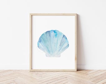 May include: A watercolor painting of a blue seashell on a white background. The seashell is a light blue color with darker blue accents. The seashell is framed in a light wood frame.