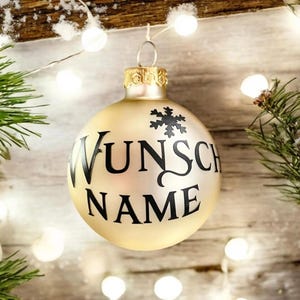 Personalized light beige, frosted or shiny Christmas tree ornaments with custom names in black, personalised gift bauble, name baubles