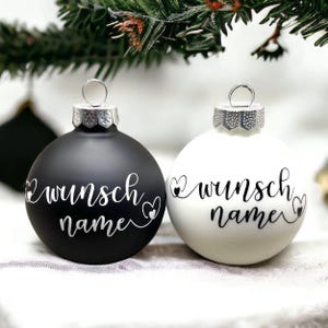 Personalized black or white frosted Christmas tree ornaments with your custom name and hearts, personalised gift bauble, name baubles.