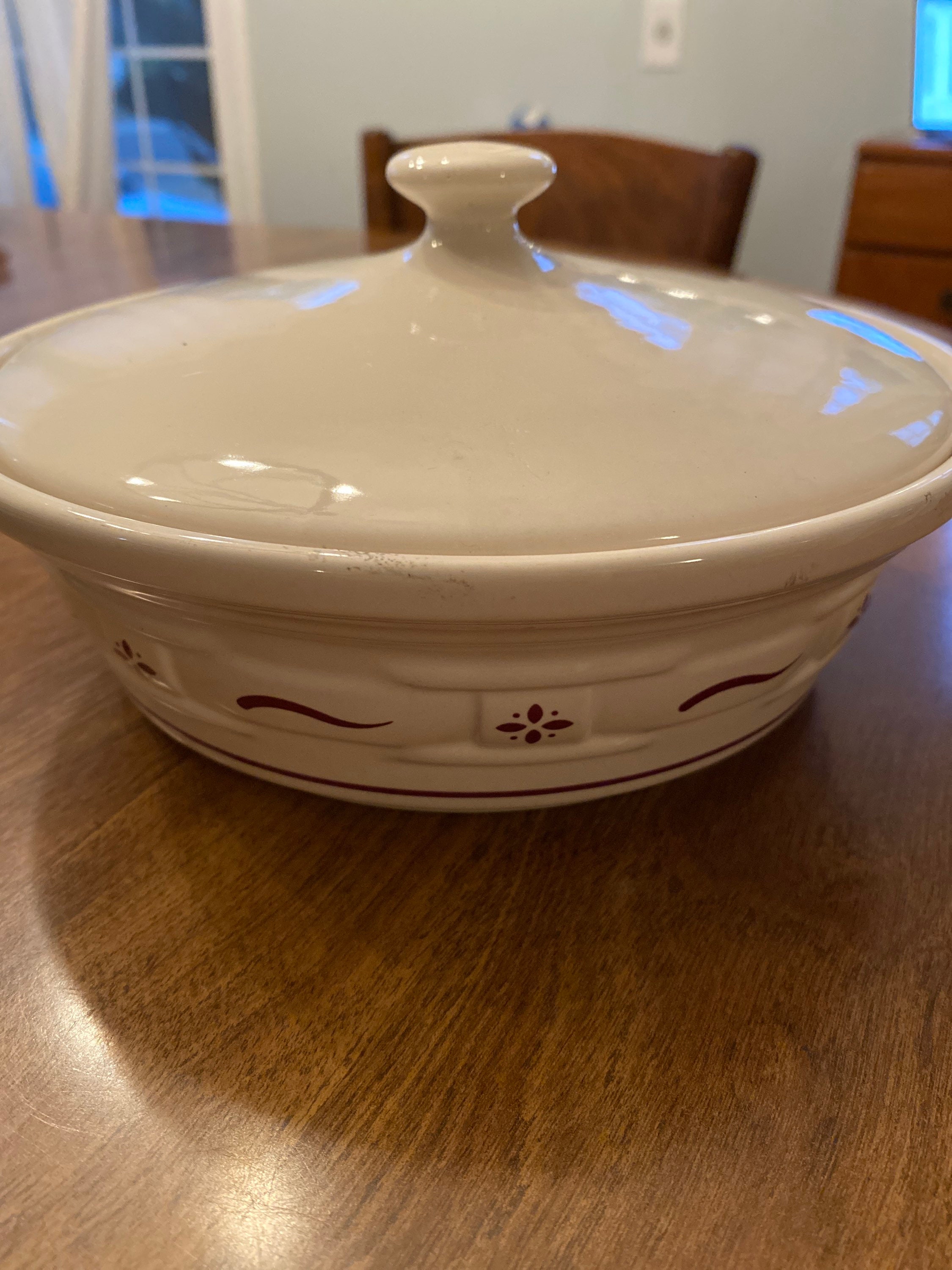 At Auction: Longaberger Pottery Woven Traditions Red Covered Casserole 2  1/2 x 8 1/4 in. (6.4 x 21 cm.)