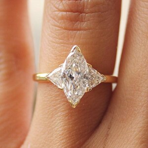 Marquise diamond with trillion side diamonds best sale