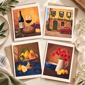 May include: A set of four greeting cards featuring artistic illustrations: one with wine, bread, and grapes; one with a red car in front of a brick building; one with pears in a bowl; and one with a pitcher of red poppies and citrus fruits.