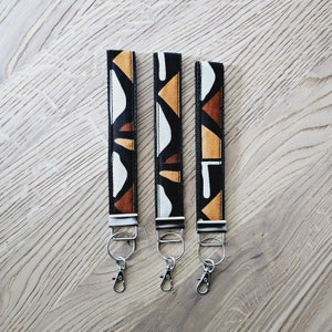 Conjunto de 3 llaveros con estampado africano / pulsera / porta llaves