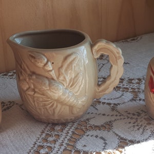 Set Pfeffer, Salzstreuer und Glas Sahne