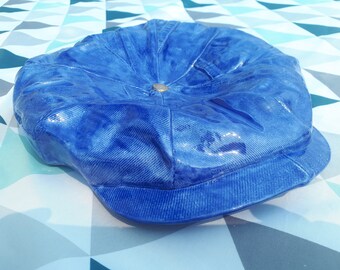 Empty pocket, ashtray or wall decoration